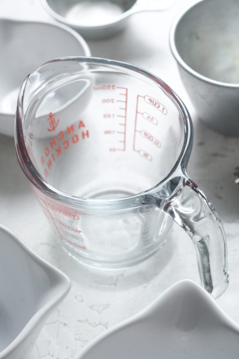 Close-up of a kitchen scale displaying grams and ounces.