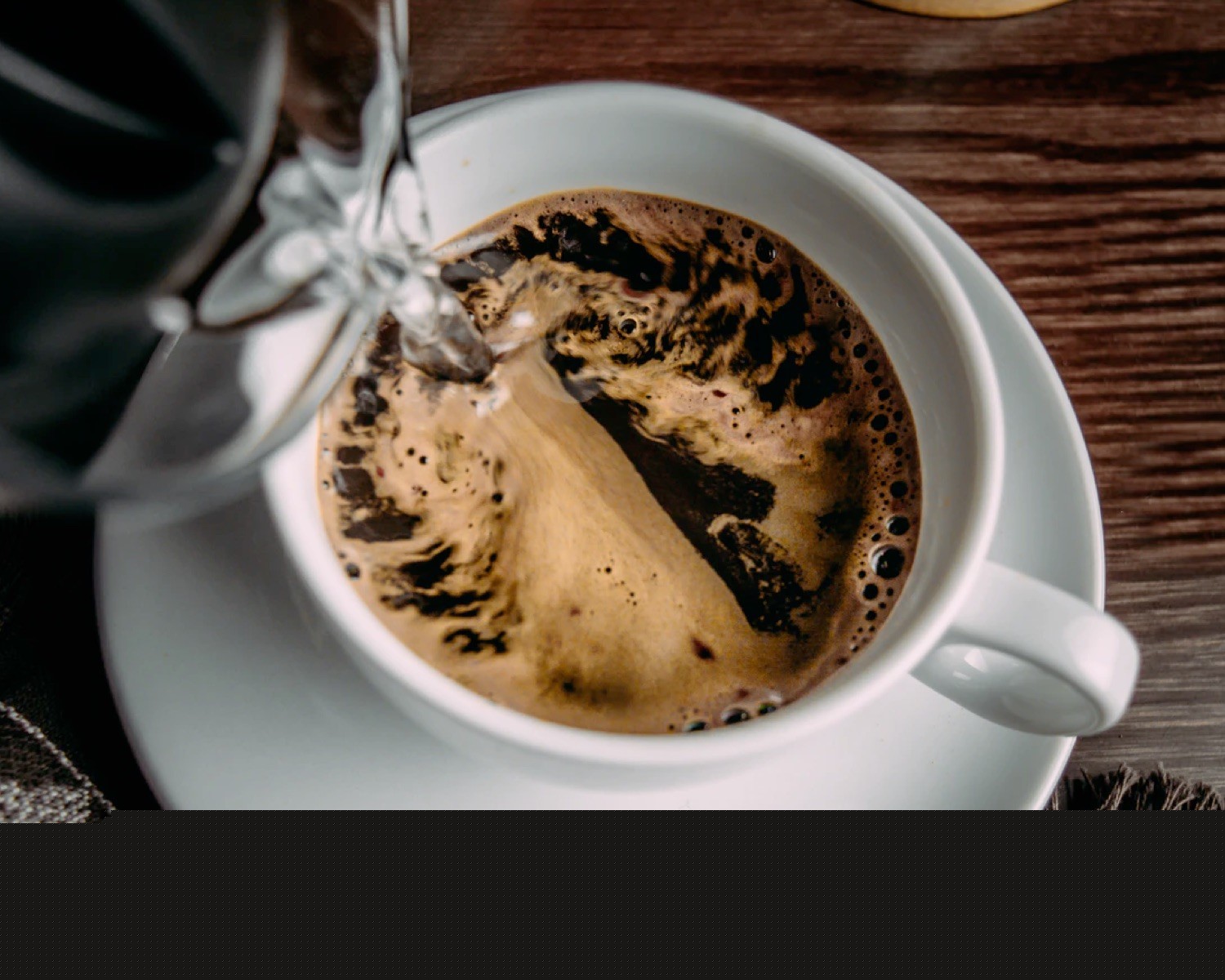 Espresso being poured into a cup