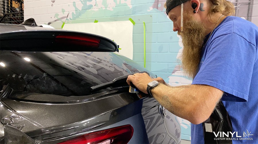 Wrap installer on car