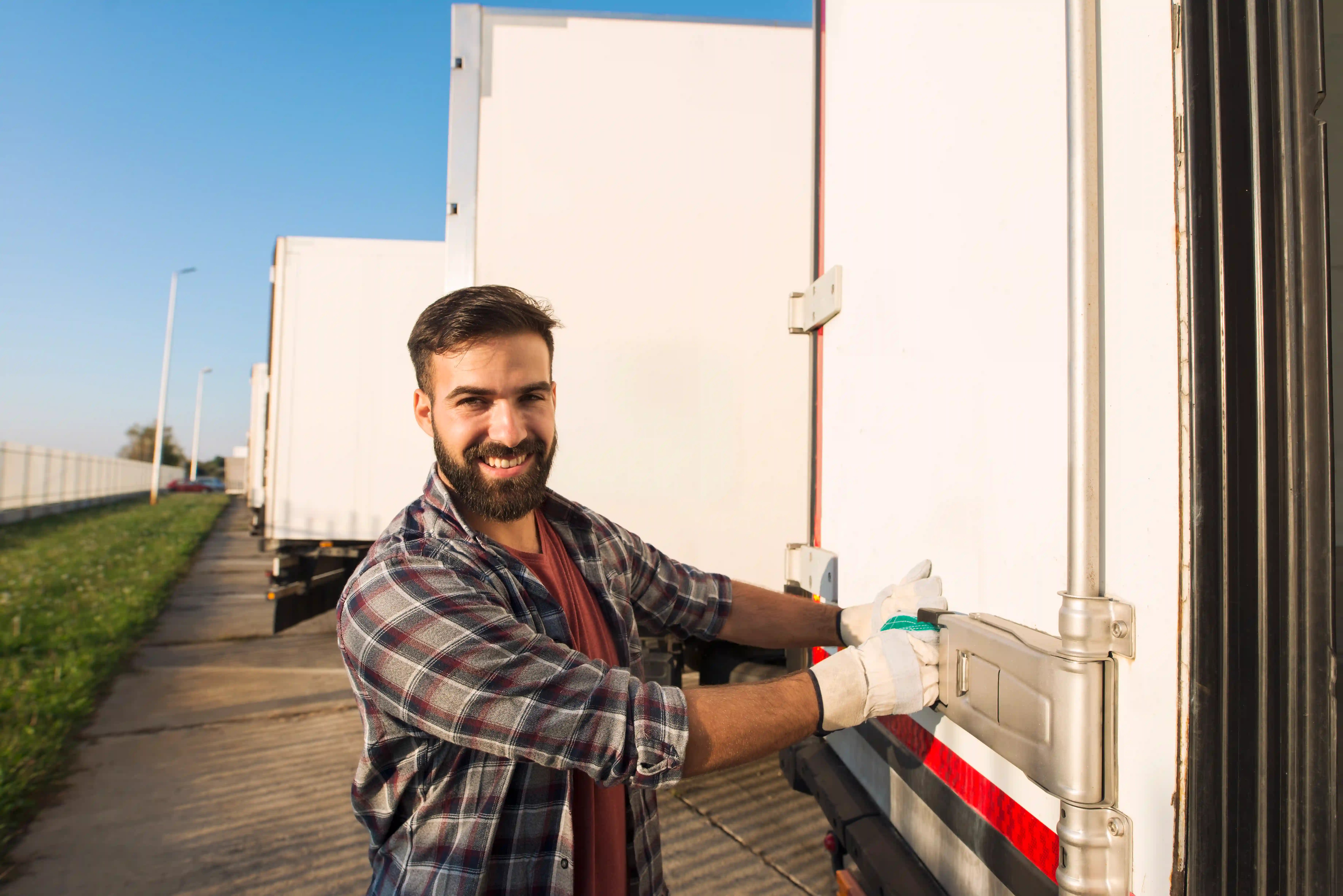 Smiling truck driver working gloves