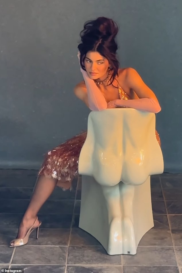 Kylie Jenner shared behind-the-scenes outtakes from her British Vogue cover shoot, showcasing a candid moment with her children