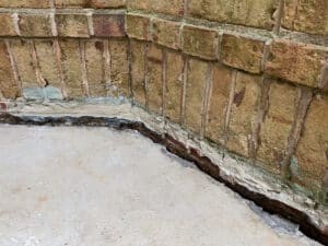Concrete foundation in need of mudjacking leveling repair.