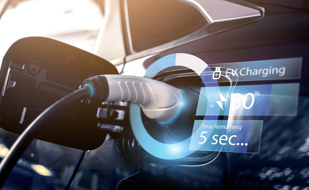 Electric car being charged with graphics showing the charging progression.