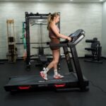 Woman walking on Bowflex BXT8J treadmill