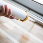 Sealing Up Window to Keep Box Elder Bugs from Entering Home