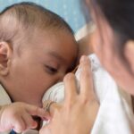 Mother nursing baby