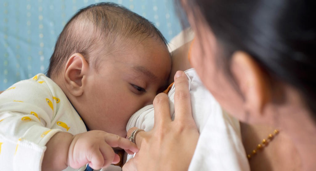 Mother nursing baby
