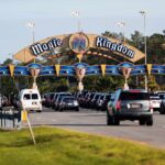 Magic Kingdom parking gates with guests arriving in cars