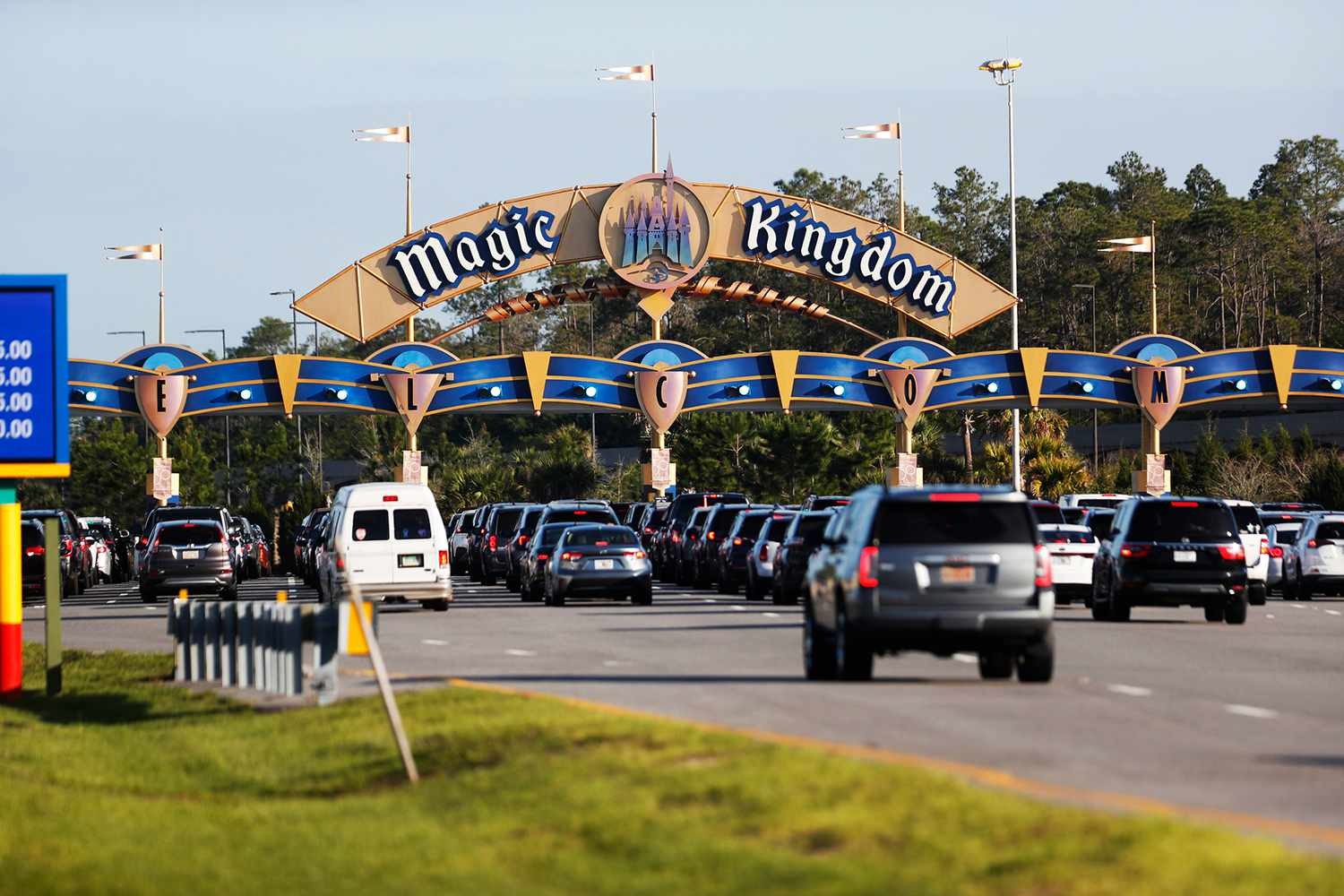 Magic Kingdom parking gates with guests arriving in cars