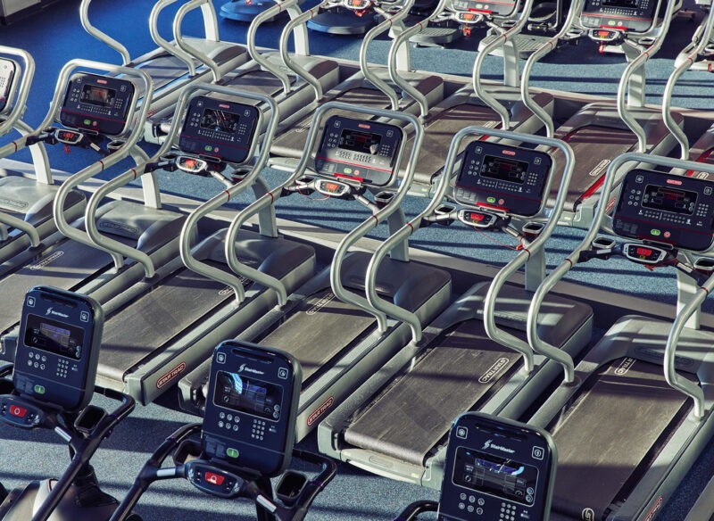 Various exercise equipment at Crunch Fitness, including treadmills, ellipticals, and stationary bikes