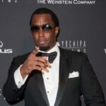 A young Sean Combs, also known as P Diddy, during his early years at Uptown Records, showcasing his ambition and dedication