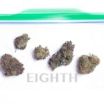 An eighth of marijuana displayed for scale