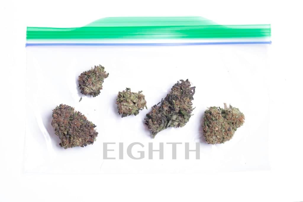 Eighth of marijuana showing 3.5 grams of cannabis, a common amount for regular users.