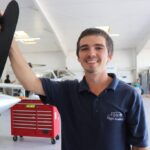 Aircraft mechanic inspecting engine