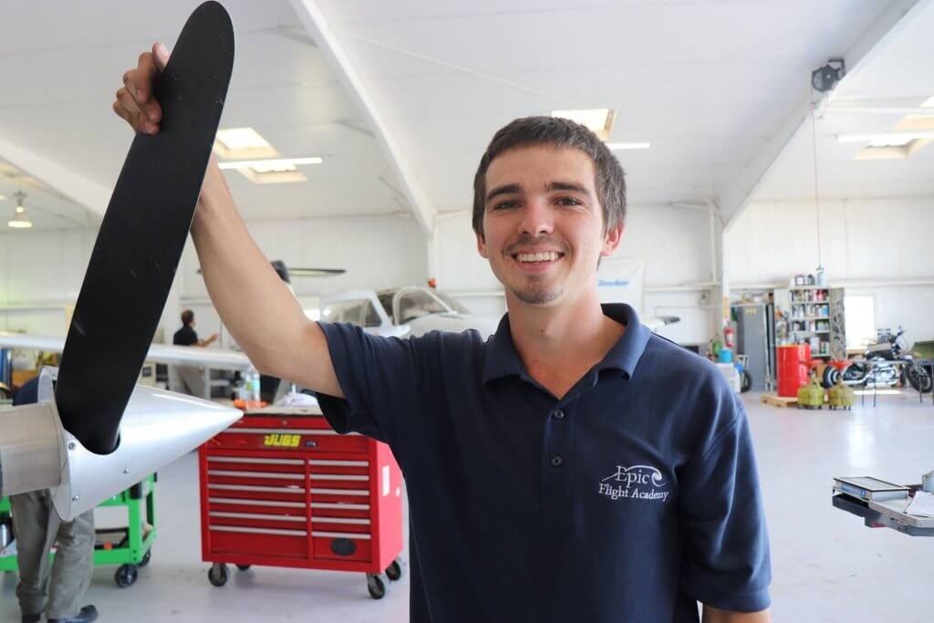 Aircraft mechanic inspecting engine