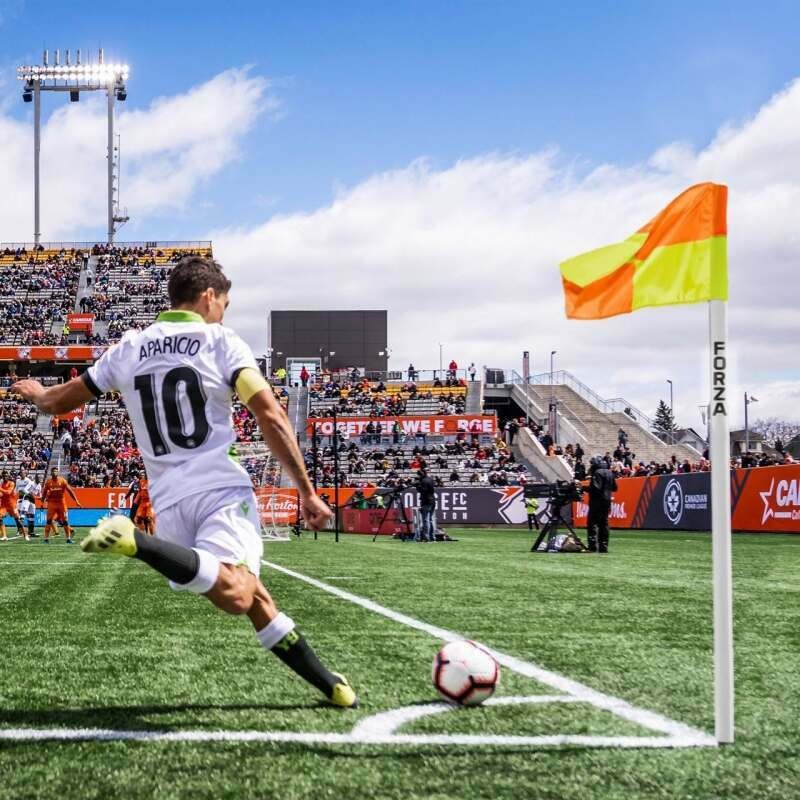 Soccer player taking a corner kick