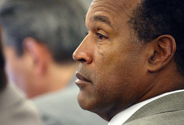O.J. Simpson listens during his trial