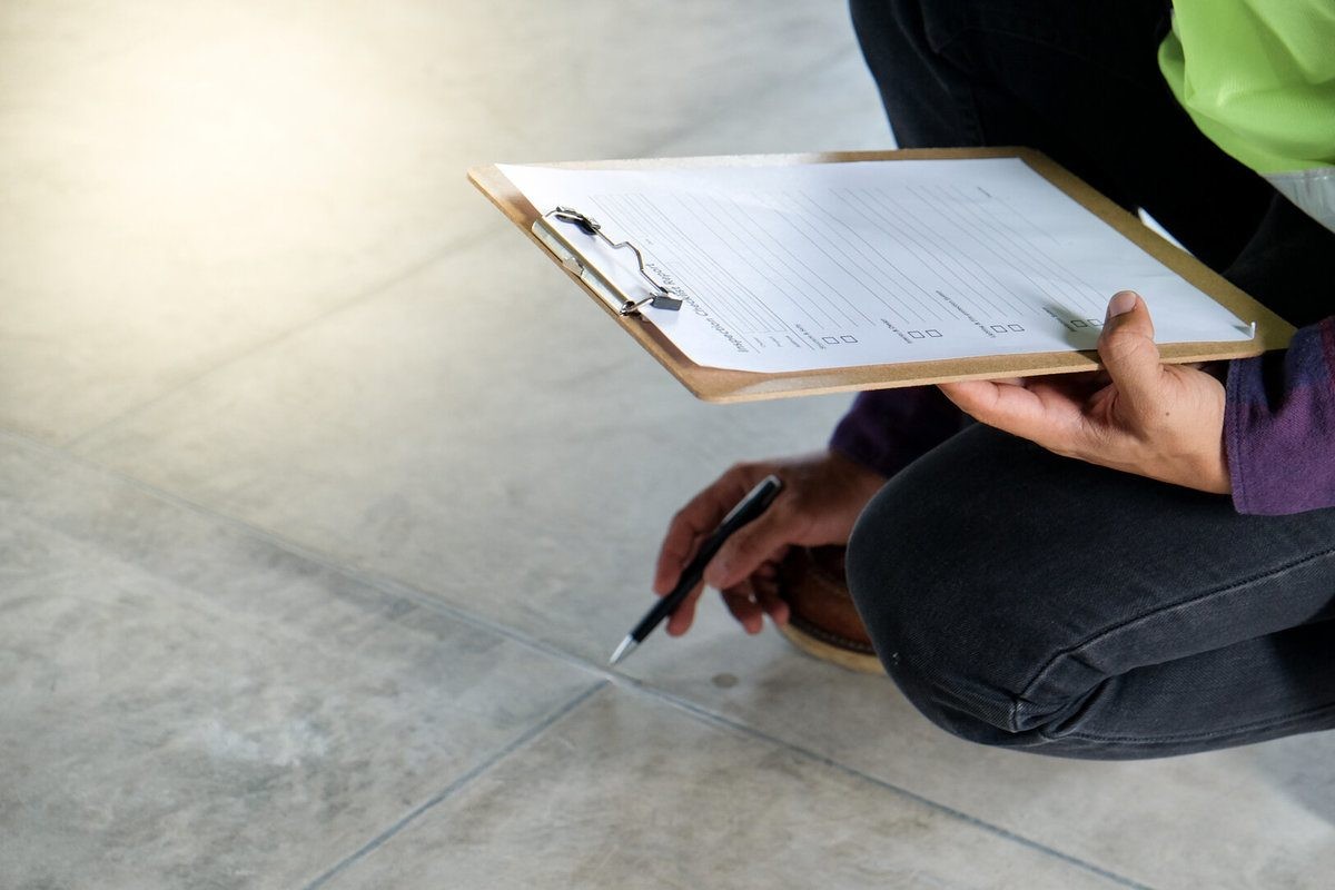 Home Inspector Checking the Floor of a House