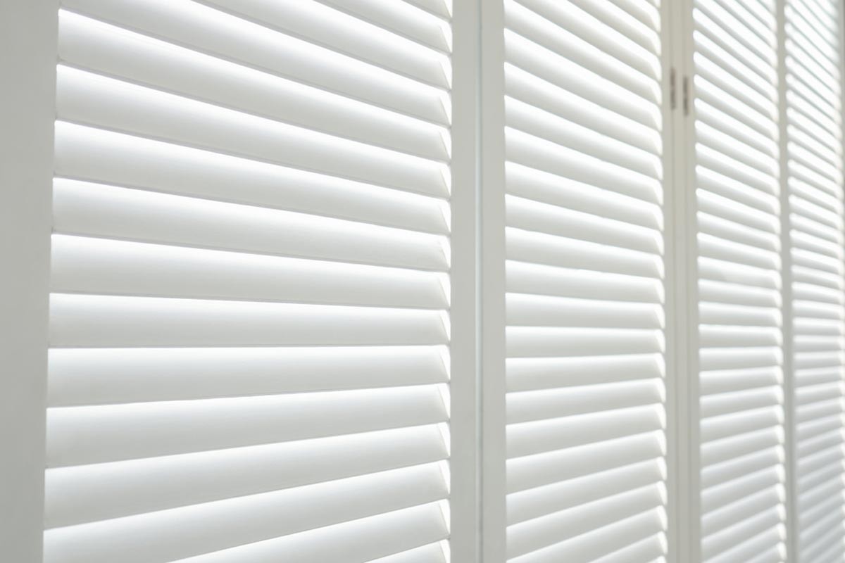White wood plantation shutters closed