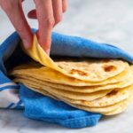 Stack of rolled flour tortillas ready for cooking