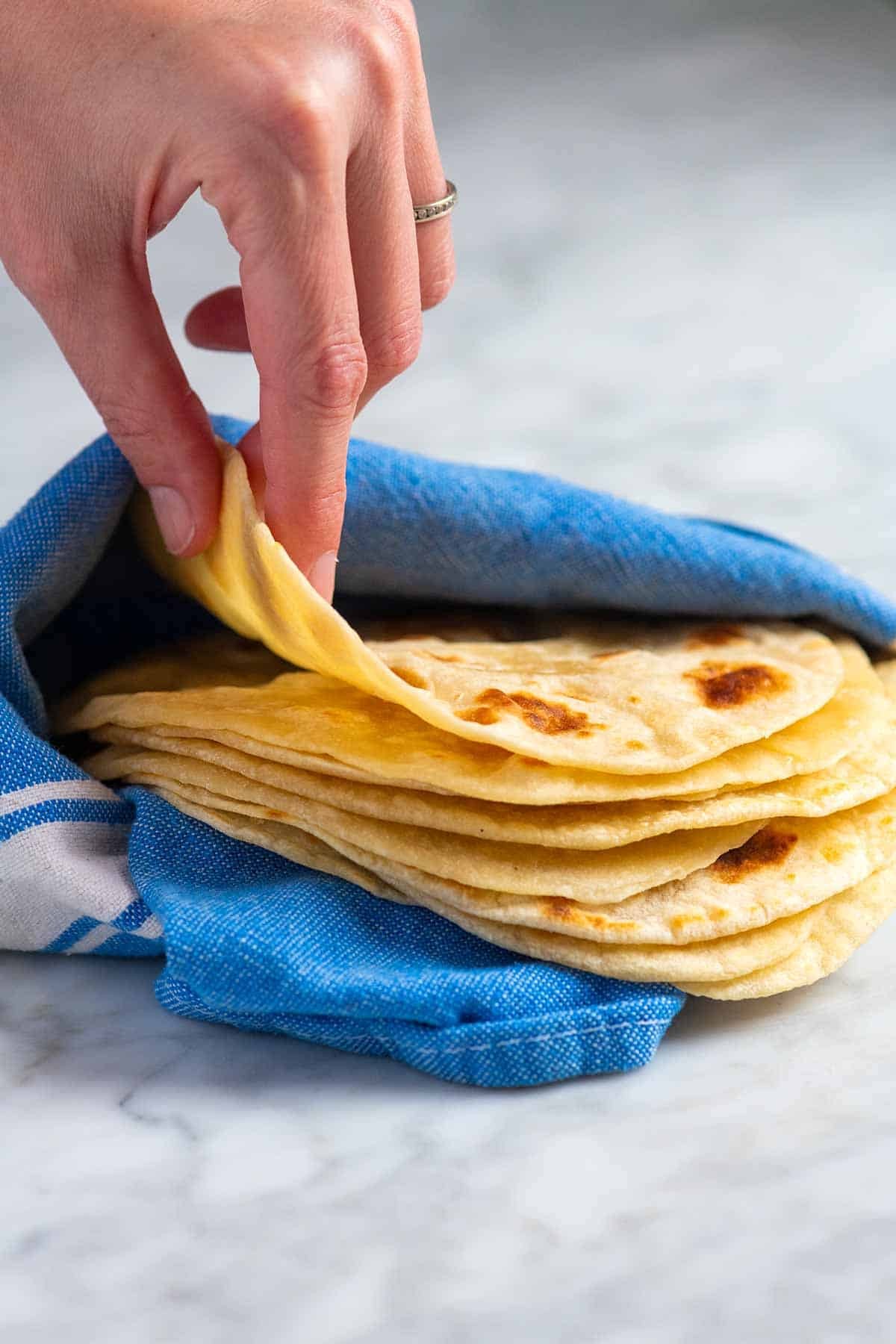 Stack of rolled flour tortillas ready for cooking