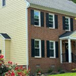 Vinyl siding installation showcasing a modern home exterior