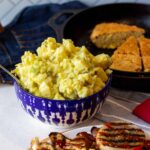 Ingredients such as potatoes, mayonnaise, mustard, eggs and dill pickles are used to make potato salad