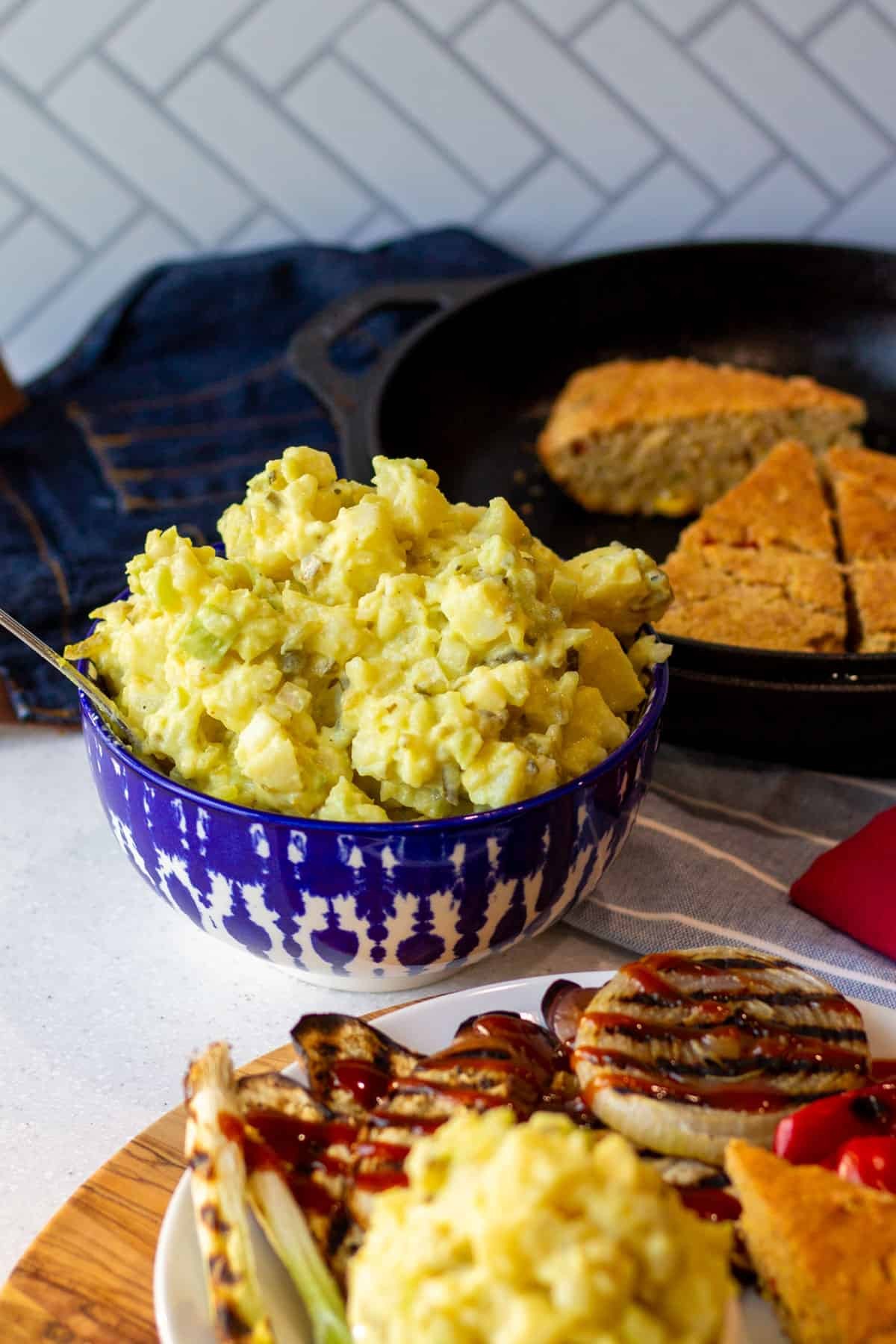 Ingredients such as potatoes, mayonnaise, mustard, eggs and dill pickles are used to make potato salad