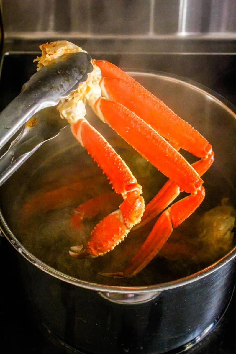 Crab legs being steamed in a pot