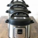 Three Instant Pots of different sizes (3 qt, 6 qt, and 8 qt) displayed on a kitchen counter, each with a steamer basket inside, illustrating the relative capacity differences.