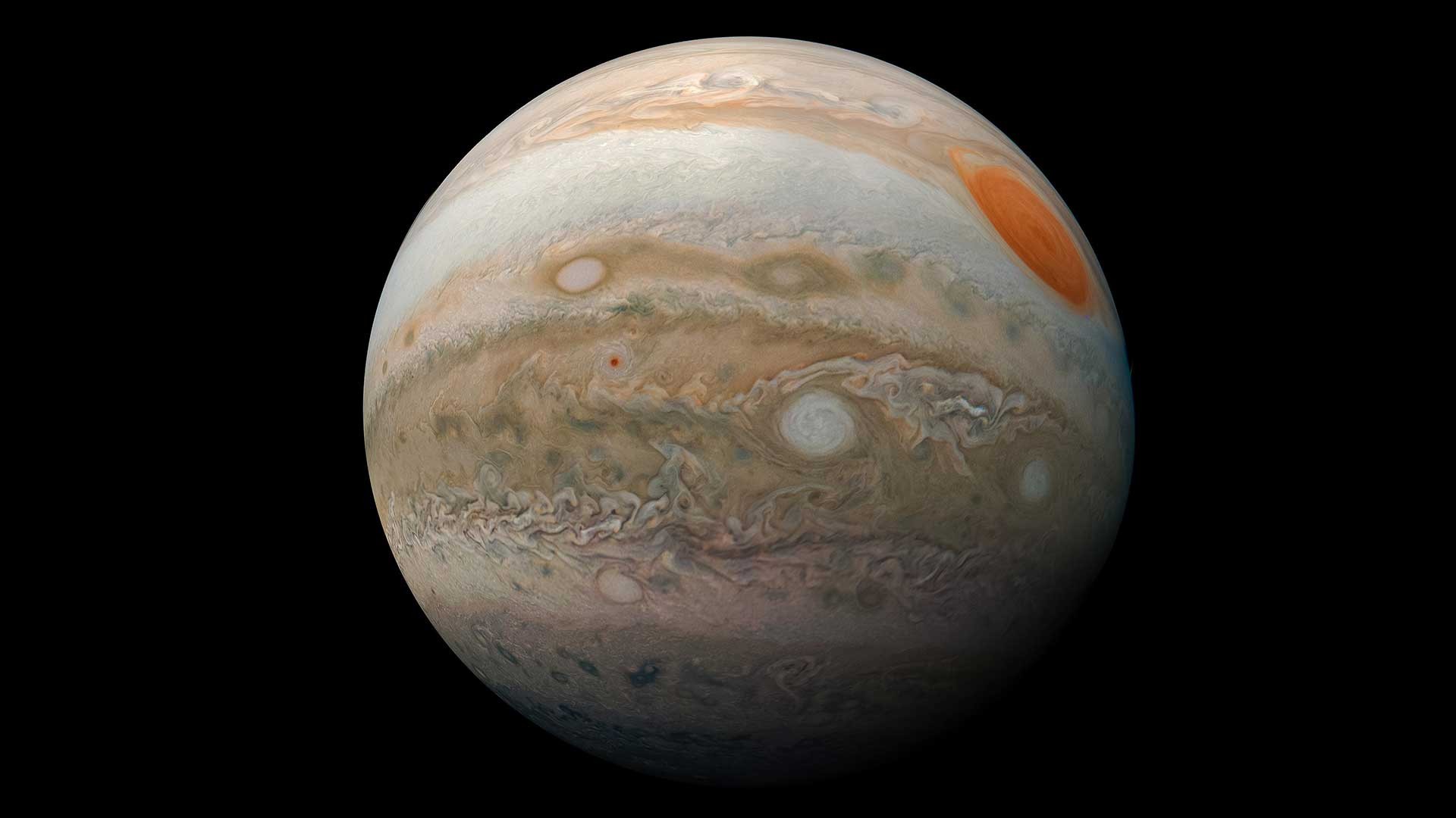 Jupiter's vibrant bands and the iconic Great Red Spot, a massive storm larger than Earth.