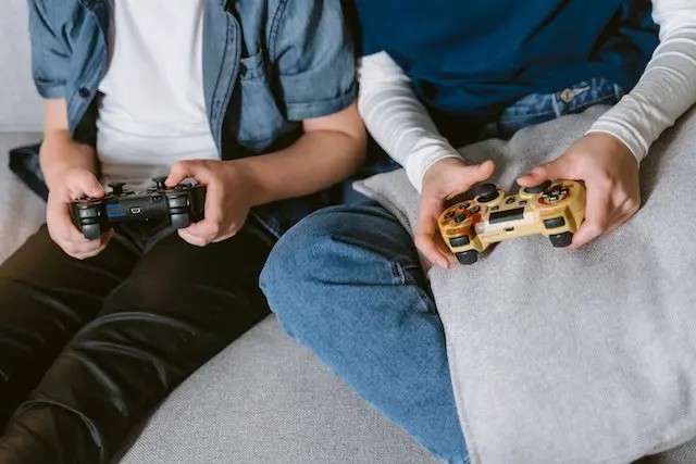 Kids engrossed in playing Minecraft together