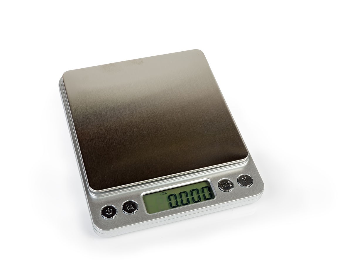 Cannabis measurements on a metal kitchen scale