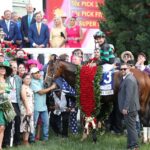 Mystik Dan draped in the garland of roses