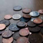 A display of old British coins including shillings.