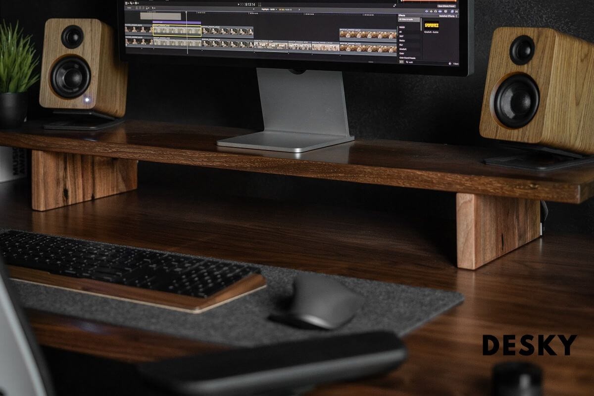 Gaming setup on a desk with PC, dual monitors, and peripherals