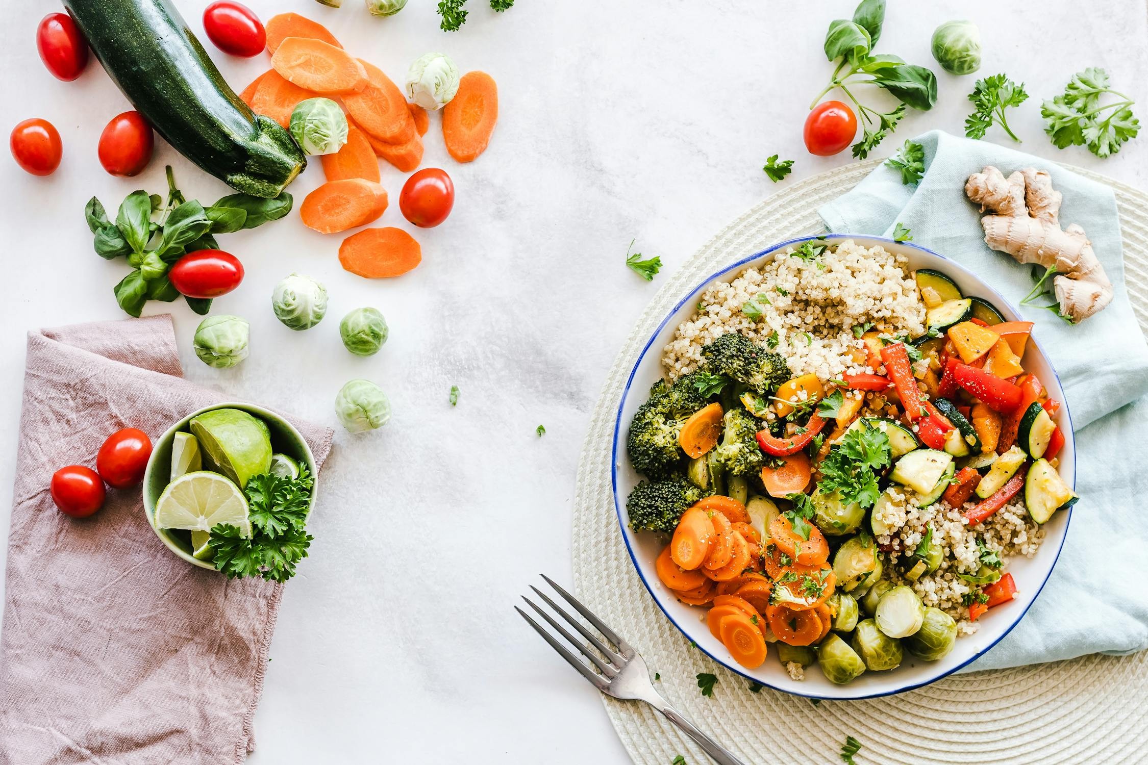 Assortment of healthy foods, including avocados, nuts, and olive oil