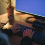 Man analyzing financial charts to manage currency exchange rates