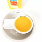 Measuring 1/4 cup of liquid with a measuring cup