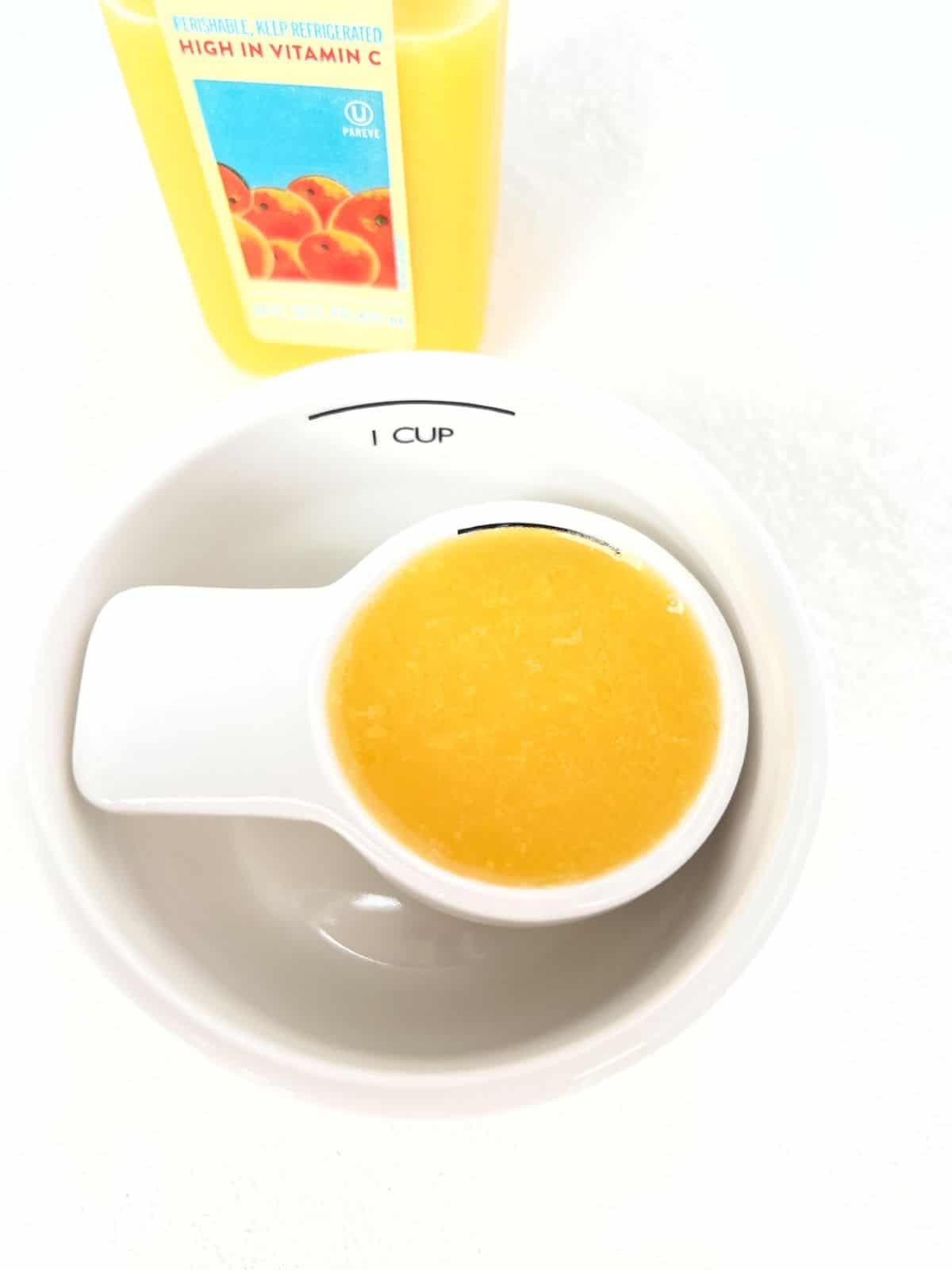 Measuring 1/4 cup of liquid with a measuring cup