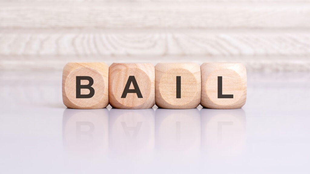Wooden blocks spelling out "Bail Bond".
