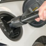 Plugging in a white Tesla