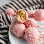 Close-up of a Starbucks birthday cake pop showing the pink coating and sprinkles.