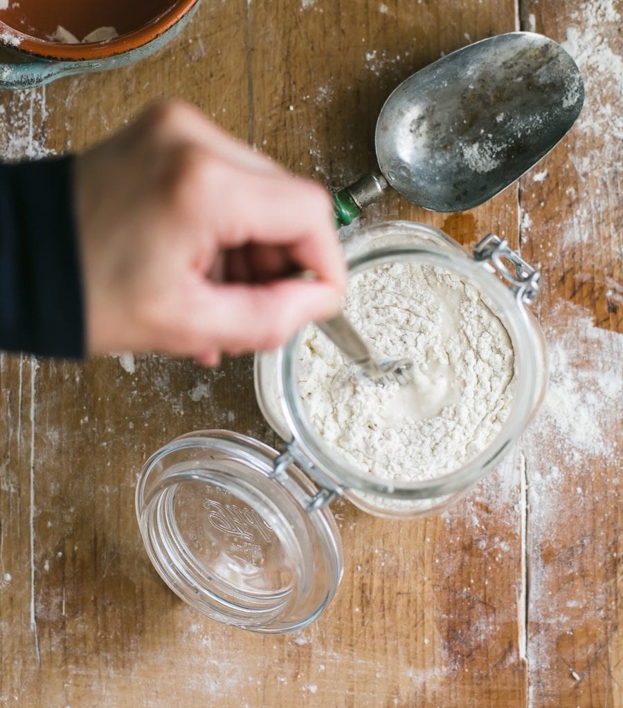 Sourdough starter in a glass jar with a lid