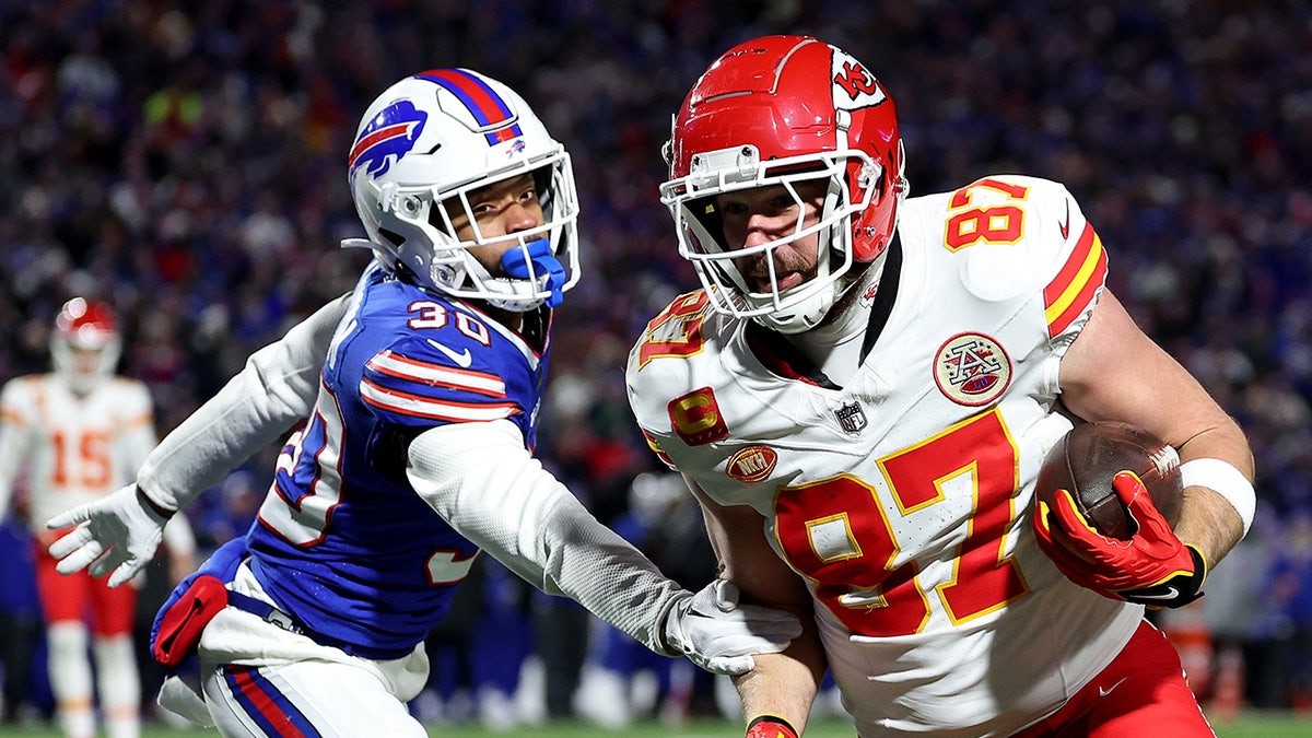 Travis Kelce in action for the Kansas City Chiefs, showcasing his athletic prowess.