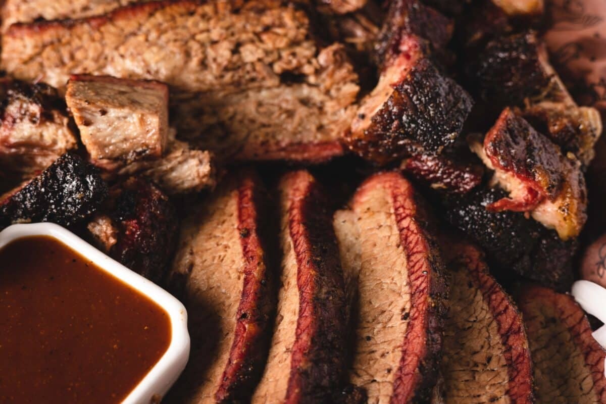 Slicing smoked brisket against the grain