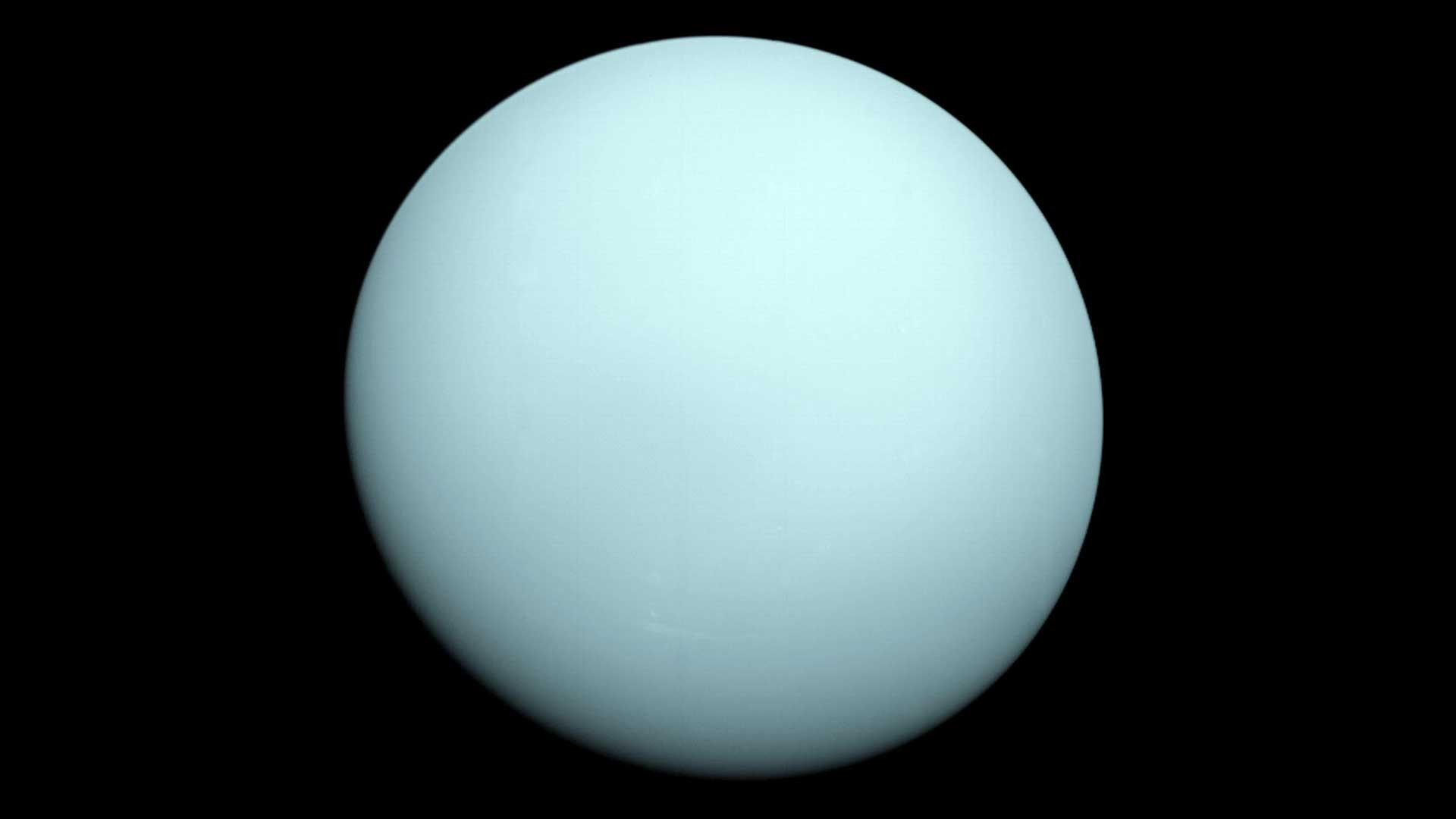 Uranus, an ice giant with a faint ring system, notable for its extreme axial tilt, captured by Voyager 2.