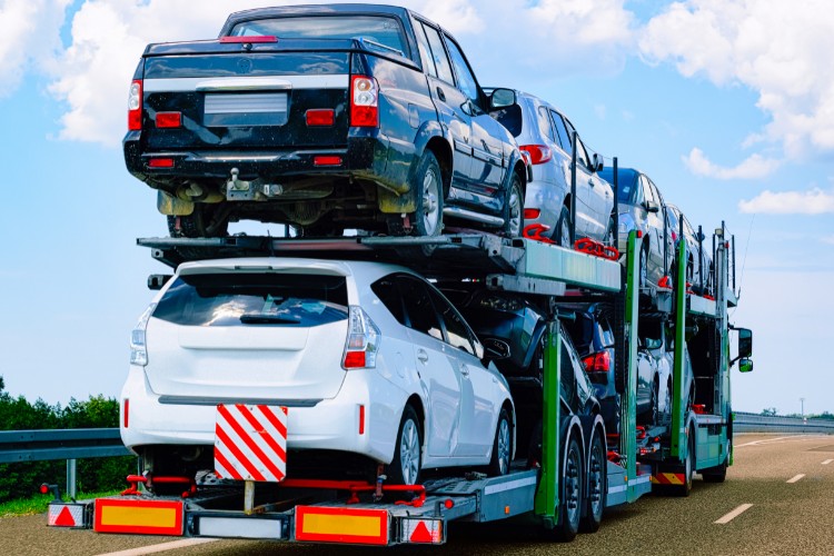 Car carrier truck transporting multiple vehicles highway